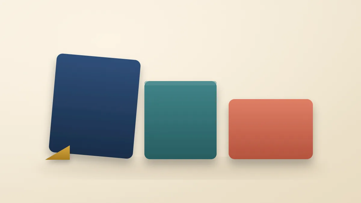 A tall navy block tilted by a small wedge at its base, a shorter coral block, and a teal block of intermediate height standing between them